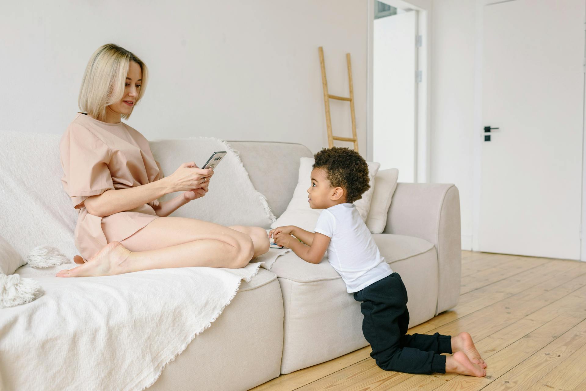 A parent and child sharing a quiet moment with a phone